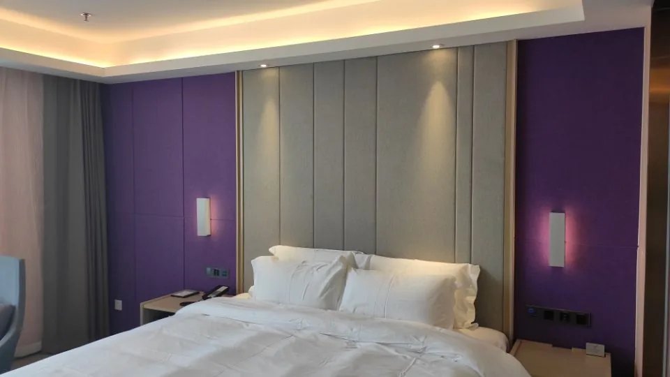 Acoustic headboard wall in hotel room